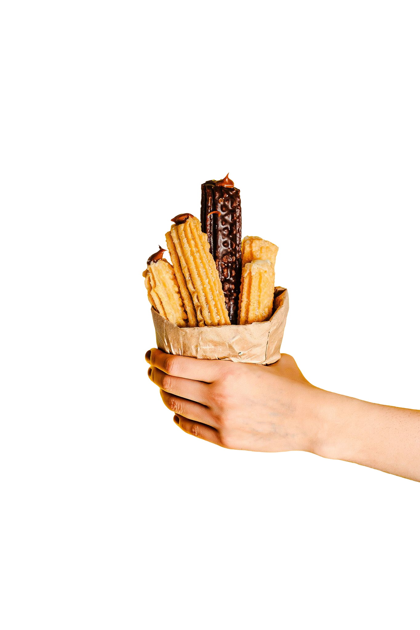 Mano sosteniendo un auténtico churro artesanal crocante de Churn